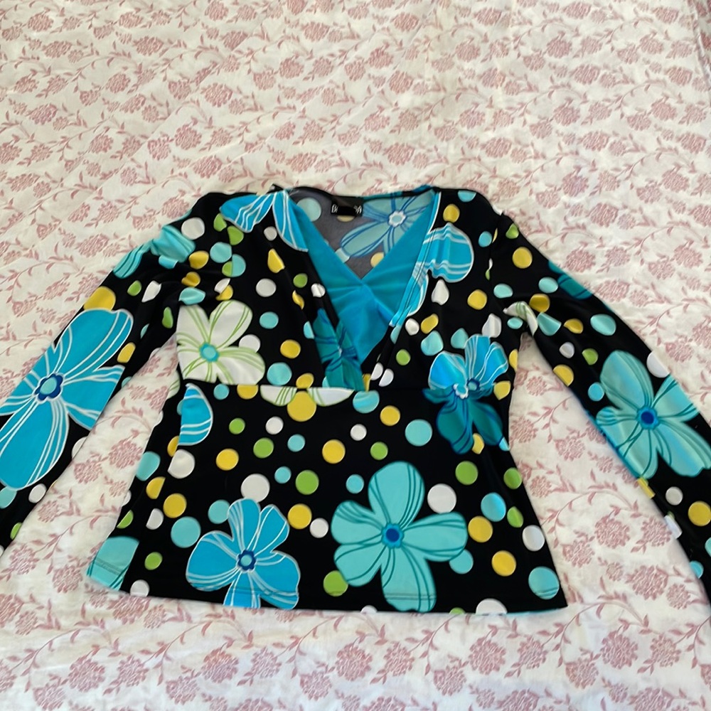 Polka dotted floral top. Labeled a size large.